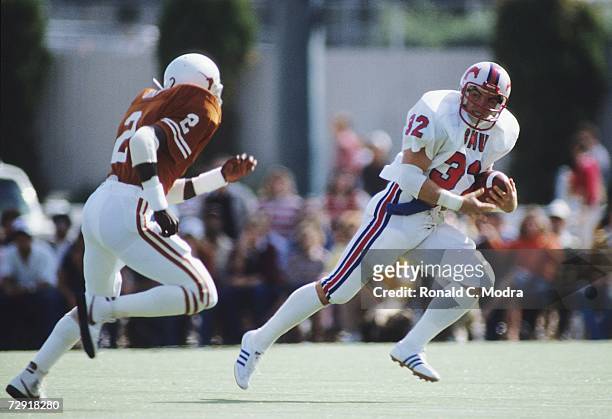 Craig James of the SMU Mustangs carries the ball during a game against the University of Texas Longhorns on October 23, 1982 in Austin, Texas. The...