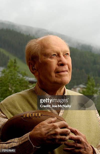 President Gerald Ford holds a 1930's-era football, the kind used during his college football career with the University of Michigan, June 30, 2004 in...
