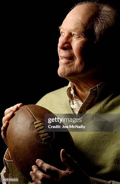 President Gerald Ford holds a 1930's-era football, the kind used during his college football career with the University of Michigan, June 30, 2004 in...
