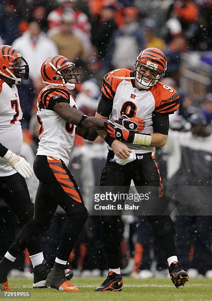 Quarterback Carson Palmer celebrates a touchdown pass with Chad Johnson of the Cincinnati Bengals against the Denver Broncos on December 24, 2006 at...
