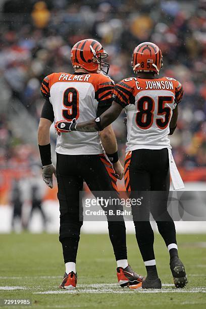 Quarterback Carson Palmer and wide receiver Chad Johnson of the Cincinnati Bengals consult against the Denver Broncos on December 24, 2006 at Invesco...