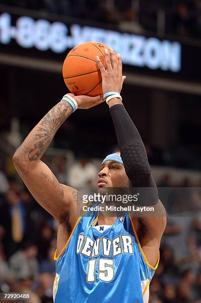 Carmelo Anthony of the Denver Nuggets shoots a free throw against the Washington Wizards during the game at the Verizon Center on December 13, 2006...