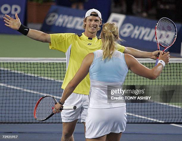 Nathan Healey and Alicia Molik of Australia celebrate their defeat of Mardy Fish and Ashley Harkleroad of the US in their mixed doubles match at the...