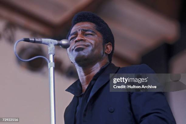American singer, songwriter and bandleader James Brown performing at the Newport Jazz Festival, circa 1968.