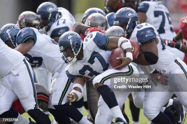 Shaun Alexander of the Seattle Seahawks runs with the ball against the Tampa Bay Buccaneers at Raymond James Stadium on December 31, 2006 in Tampa,...