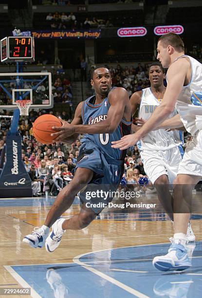 Gilbert Arenas of the Washington Wizards dribbles the ball against the Denver Nuggets on December 18, 2006 at the Pepsi Center in Denver, Colorado....