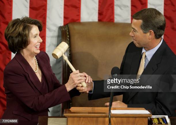 Speaker of the House Nancy Pelosi takes the Speaker's gavel from House Minority Leader Rep. John Boehner after being elected as the first woman...