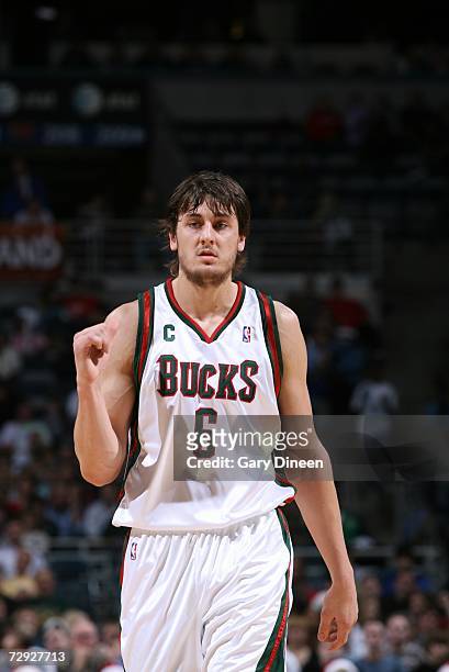 Andrew Bogut of the Milwaukee Bucks walks downcourt during the game against the New Jersey Nets at Bradley Center on December 23, 2006 in Milwaukee,...