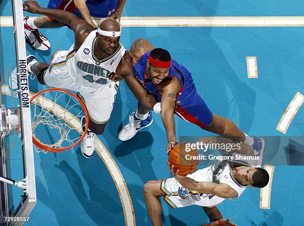 Rasheed Wallace of the Detroit Pistons battles with Marc Jackson and Jannero Pargo of the New Orleans/Oklahoma City Hornets on January 4, 2007 at the...