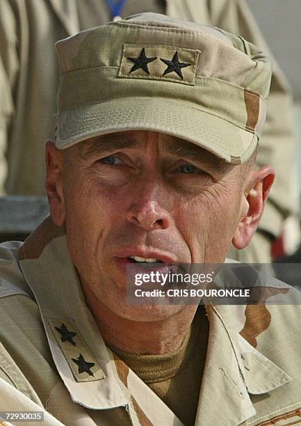 -- In this 06 January 2004 file photo, US Lieutenant General David Petraeus participates in a ceremony in Mosul, Iraq, commemorating the 83rd...