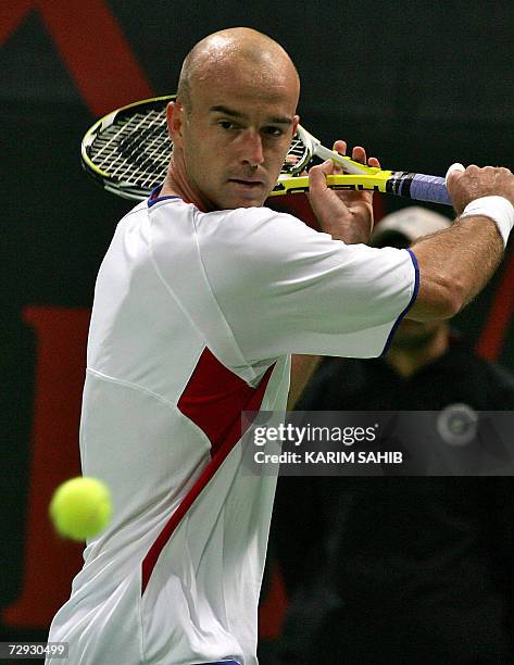 Ivan Ljubicic of Croatia returns the ball to Sweden's Robin Soderling during their semi-final match at the one-million-dollar Qatar Open ATP tennis...