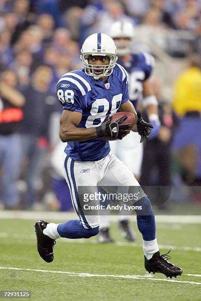 Marvin Harrison of the Indianapolis Colts carries the ball during the game against the Cincinnati Bengals at the RCA Dome on December 18, 2006 in...