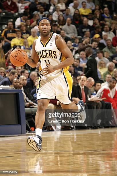Jamaal Tinsley of the Indiana Pacers drives against the Houston Rockets at Conseco Fieldhouse December 26, 2006 in Indianapolis, Indiana. The Pacers...