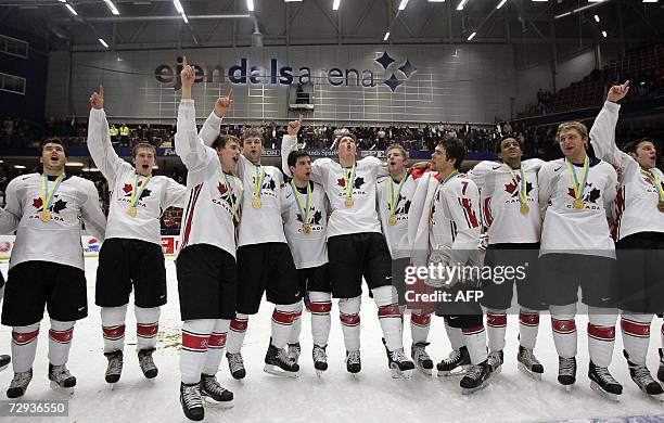 Team Canada players celebrate with gold medals around their necks after winning against Russia 4-2 in final at the 2007 IIHF World U20 hockey...