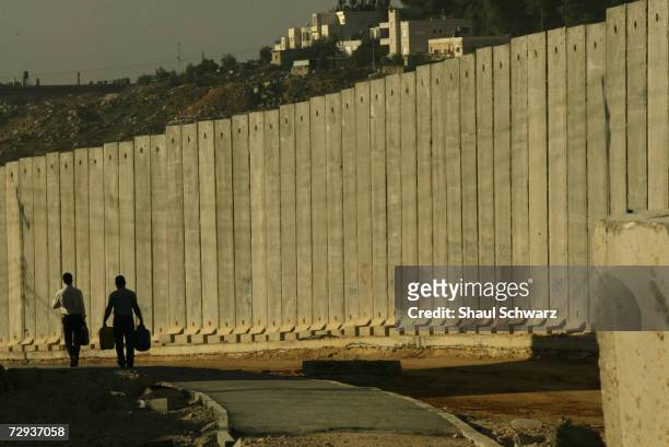 View of a concrete security wall in Kalandia separating the West Bank city near Ramalla from East Jerusalem November 10, 2004. The huge concrete...