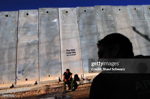 View of a concrete security wall in Kalandia separating the West Bank city near Ramalla from East Jerusalem November 10, 2004. The huge concrete...