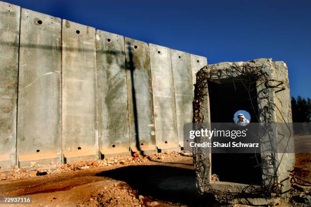 View of a concrete security wall in Kalandia separating the West Bank city near Ramalla from East Jerusalem November 10, 2004. The huge concrete...