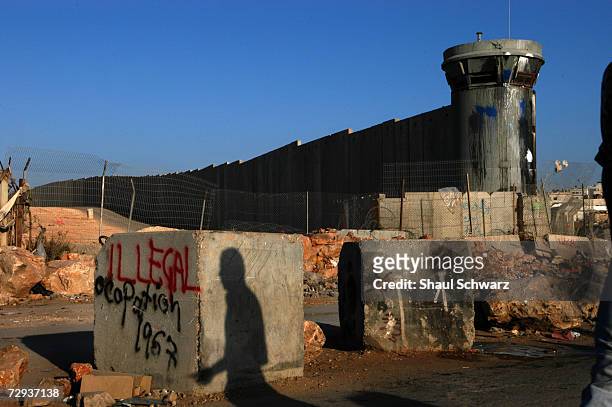 View of a concrete security wall in Kalandia separating the West Bank city near Ramalla from East Jerusalem November 10, 2004. The huge concrete...