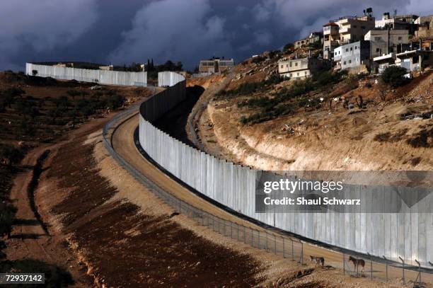 View of the concrete separation wall between the Palestinian city of Abu Dis and Israel, November 22, 2004. With Gaza already being separated by a...