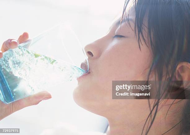 woman drinking lime water - taste for a cure stock pictures, royalty-free photos & images