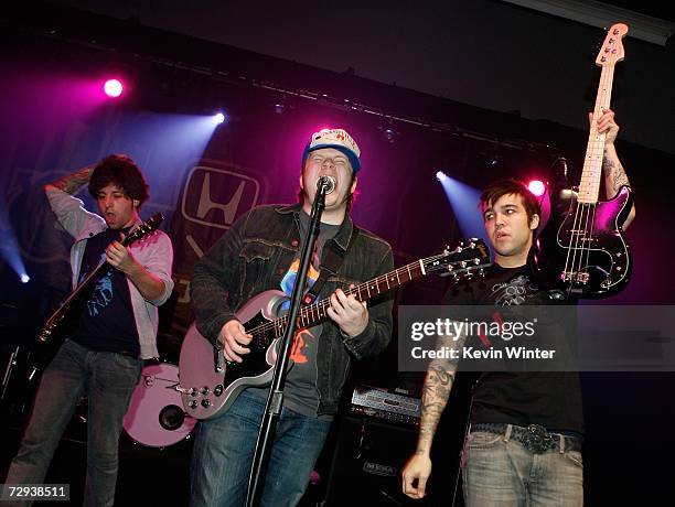 Musicians Joe Trohman, Patrick Stump, and Pete Wentz of the musical group Fall Out Boy perform during their press conference announcing their...