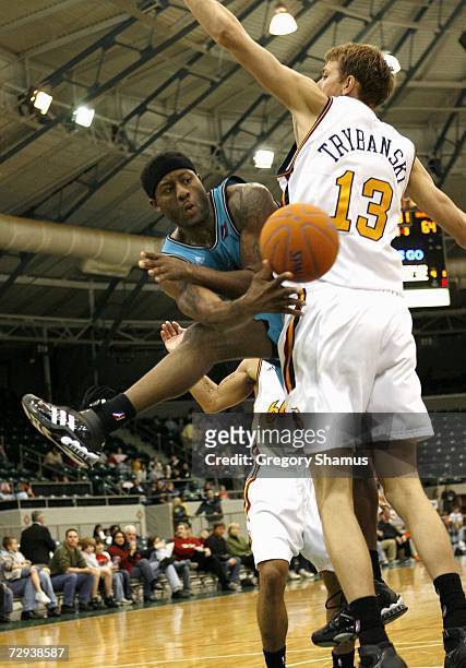 Corey Williams of the Sioux Falls Skyforce makes a pass around Cezary Trybanski of the Tulsa 66ers during a NBDL game at the Expo Square Pavilion...