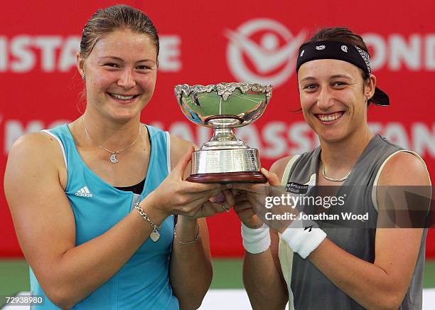 Dinara Safina of Russia and playing partner Katarina Srebotnik of Slovakia pose with the winners trophy after their final doubles match against Iveta...