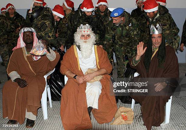 Spanish UN soldiers, three of them dressed as the three wise men in the Biblical story, pose for a group picture during an Epiphany celebration 05...