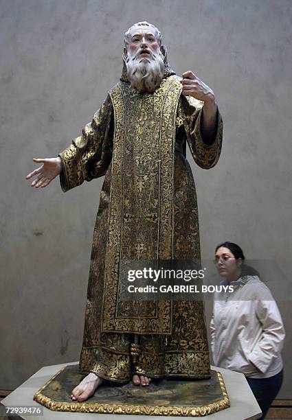 Los Angeles, UNITED STATES: A woman looks at "Saint Gines de la Jara" by Spanish La Roldana at the Getty Center in Los Angeles, 05 January 2007. AFP...