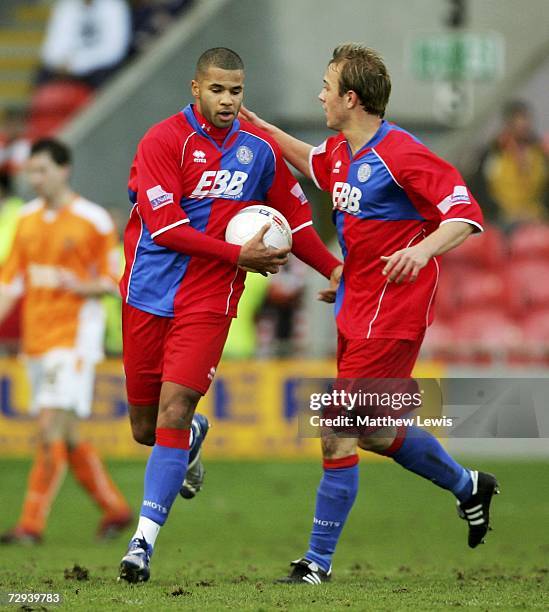 John Grant of Aldershot is congratulated on his goal by Ryan Scott during the FA Cup sponsored by E.ON Third Round match between Blackpool and...