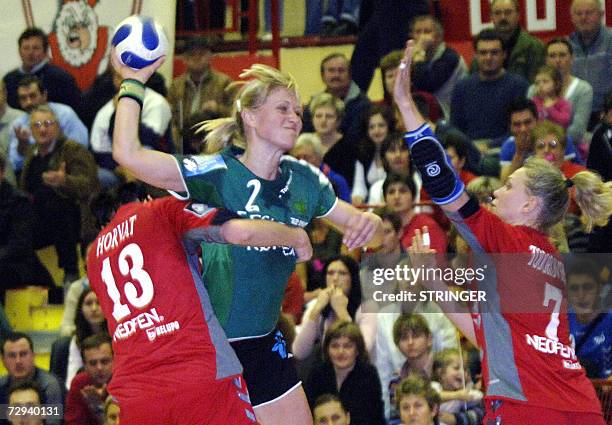 Viborg's Ehadsen Skov Rikke tries to score between Podravka Vegeta's Lidija Horvat and atalia Todorovska during their Champion league match in...