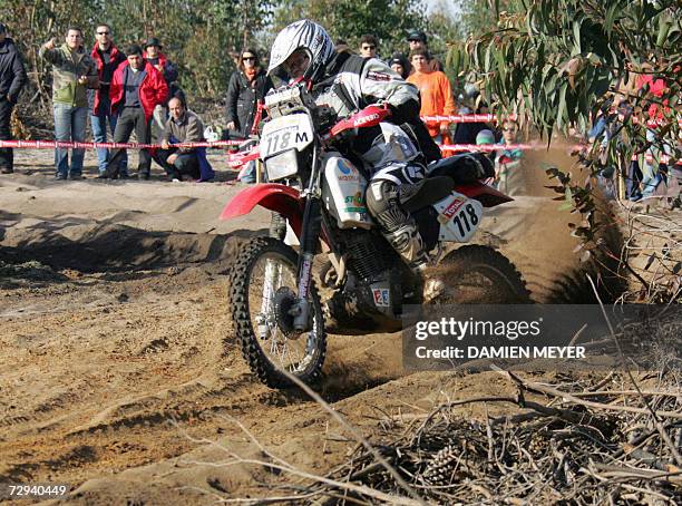France's Anne-Charlotte Tilliette rides during the first stage of the 29th Dakar between Lisbon and Portimao, 06 January 2007. Portugal's Ruben Faria...