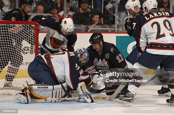 Kari Lehtonen of the Atlanta Thrashers makes a save against Chris Clark of the Washington Capitals during a NHL hockey game at the Verizon Center...