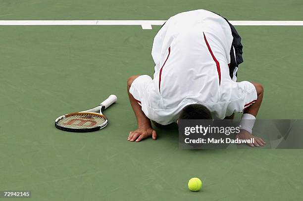 Novak Djokovic of Serbia kisses the court after defeating Chris Guccione of Australia during the final day of the 2007 Next Generation Adelaide...