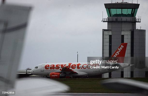 Aircraft operated by the budget airline EasyJet sits on the runway at Bristol International Airport January 7, 2006 in Bristol, England. Thousands of...