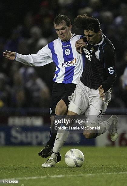 Georgios Samaras of Manchester City battles with Burton O'Brien of Sheffield Wednesday during the FA Cup sponsored by E.ON Third Round match between...