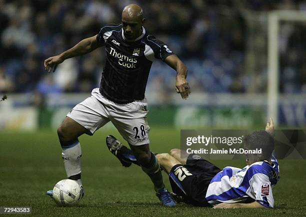Trevor Sinclair of Manchester City is tackled by Tommy Spur of Sheffield Wednesday during the FA Cup sponsored by E.ON Third Round match between...