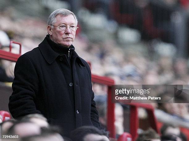 Manager Sir Alex Ferguson of Manchester United watches from the dug out during the FA Cup sponsored by E.ON Third Round match between Manchester...