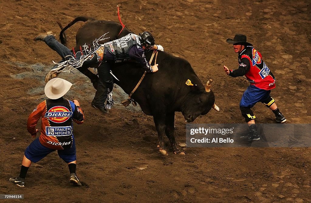 New Bull Riders Chad Denton struggles to free his hand from the bull during the... News ...