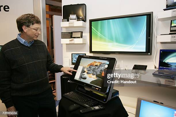 In this handout photo provided by Microsoft, Microsoft chairman Bill Gates demonstrates an HP TouchSmart PC loaded with Windows Vista before his...