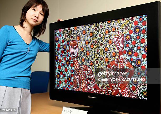Misa Nakayama of Japan's electronics giant Matsushita, unveils the prototype model of a 42-inch sized high-definition plasma display panel , which...
