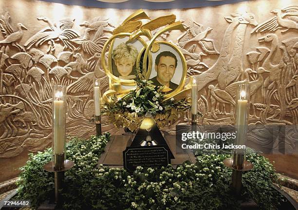 Candles burn beside The Diana, Princess of Wales and Dodi Fayed memorial in Harrods on January 8, 2006 in London, England. An inquest into the deaths...