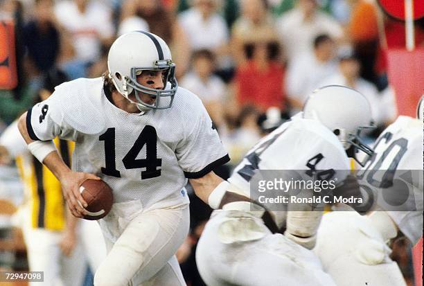 Quarterback Todd Blackledge of the Penn State Nittany Lions drops back during a game against the University of Miami Hurricanes on October 31, 1981...