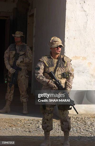 Kandahar, AFGHANISTAN: Two Canadian soldiers of the NATO-led International Security Assistance Force stand guard at the Provincial Reconstruction...