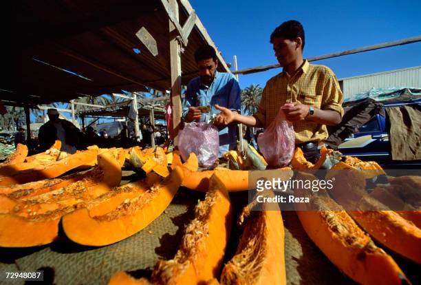 Market vendor sells melons at a Libyan market in May 2000 in Libya.