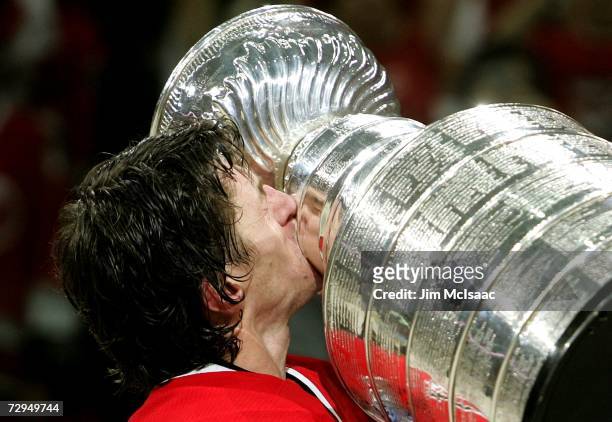 Rod Brind'Amour of the Carolina Hurricanes kisses the Stanley Cup after defeating the Edmonton Oilers in game seven of the 2006 NHL Stanley Cup...