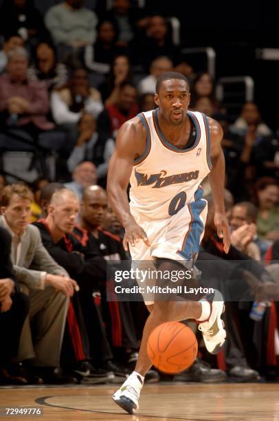 Gilbert Arenas of the Washington Wizards drives against the Miami Heat during a NBA basketball game on December 15, 2006 at the Verizon Center in...