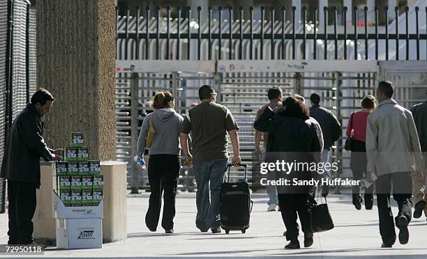 Pedestrians head through turnstiles into Mexico from the United States January 8, 2007 in San Ysidro, California. Beginning on January 23rd, United...