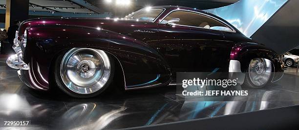Detroit, UNITED STATES: The Holden Efijy concept car, painted in ?Soprano Purple? paintwork highlighting its curvaceous 5.2-metre body,...