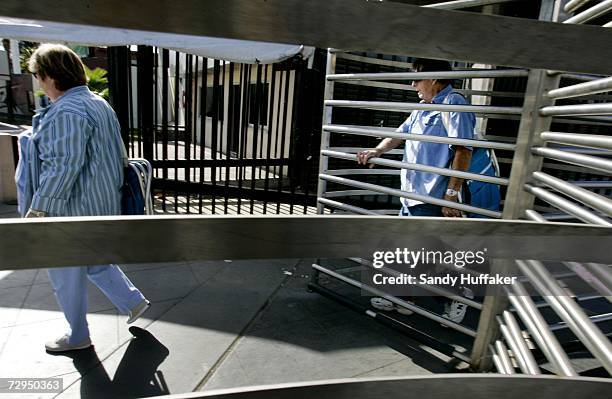 Pedestrians head through turnstiles into Mexico from the United States on Monday, January 8, 2006 in San Ysidro, California. Beginning on January...